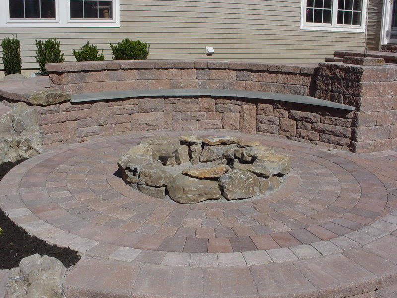 moss rock fire pit with seating wall